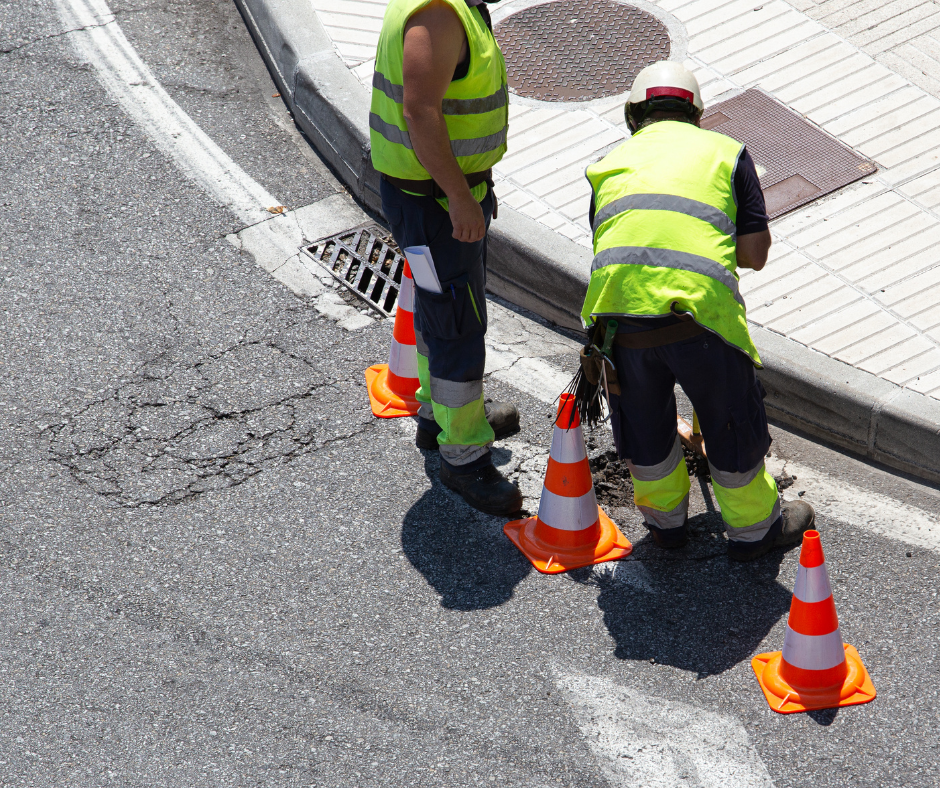image of workers repairing a road